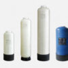 Set of four FRP Fiberglass Pressure Tanks in different sizes and colors (Natural and Blue) for water filtration."